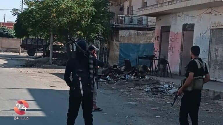 صورة للمسلحين المحليين في بلدة محجة
